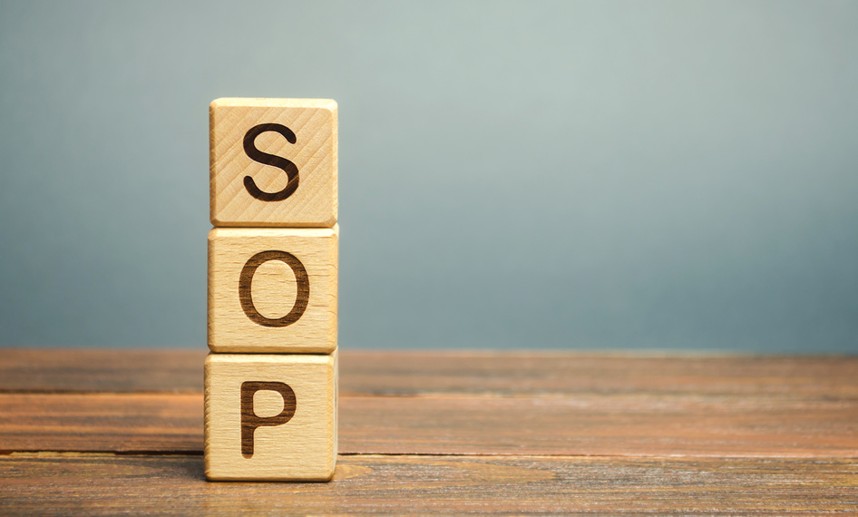 Wooden blocks with the word SOP ( Standard operating procedure ). Instructions to assist employees in complex routine operations. Business concept